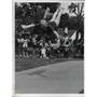 1974 Press Photo Girl takes a leap in the air during gymnastics routine