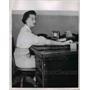 1954 Press Photo Office Secretary band keeps blouse down under  - nee91341